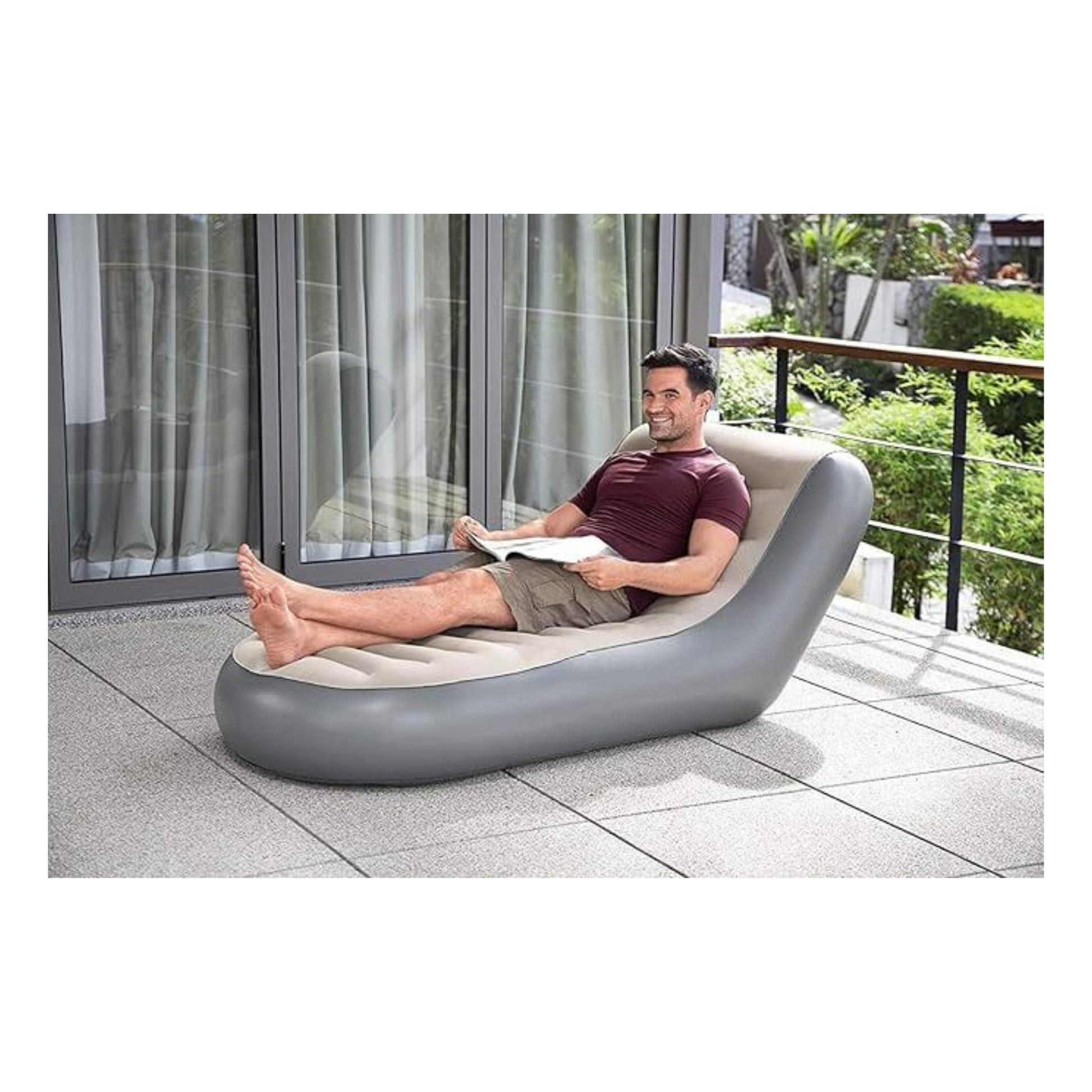 Man relaxing on a modern outdoor chair with a scenic background